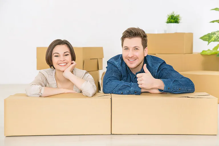 A couple with boxed items ready to go in storage 